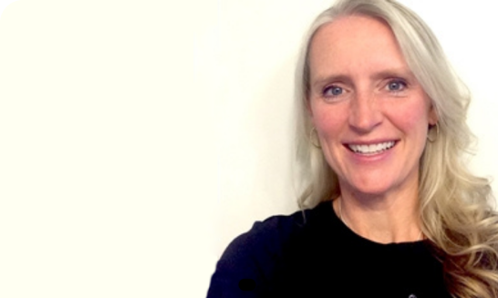 Amy M. poses for her picture for an article that spotlights corporate leaders at ADT.