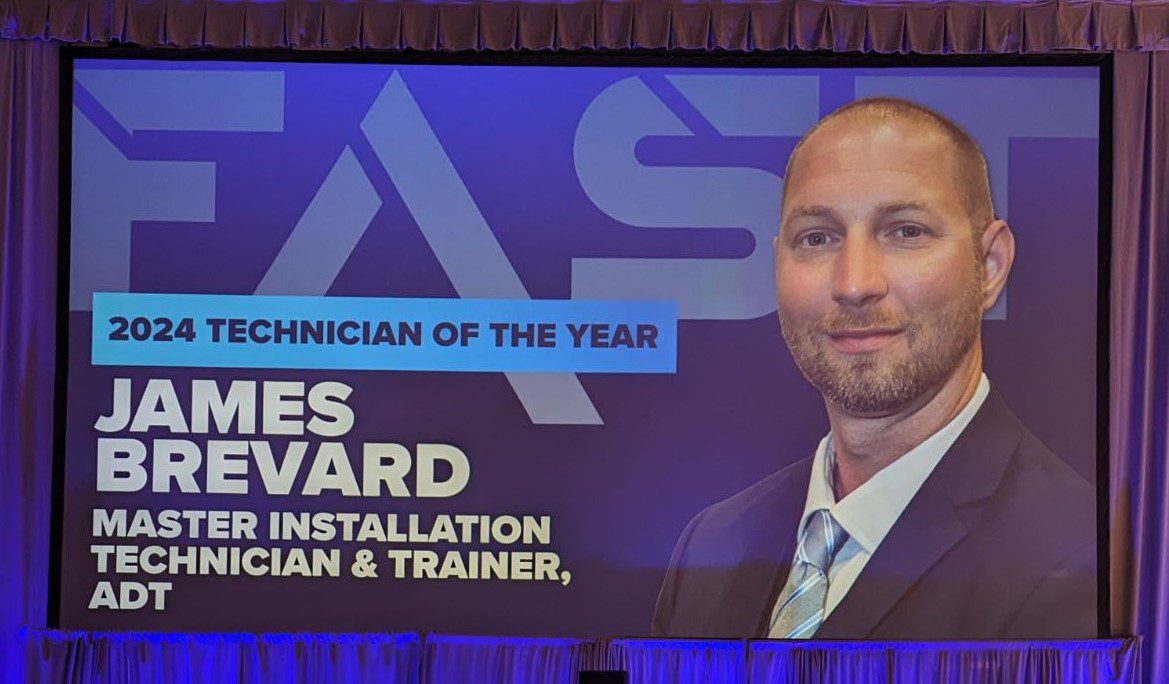 a screen of a picture of james that says "Technician of the Year"